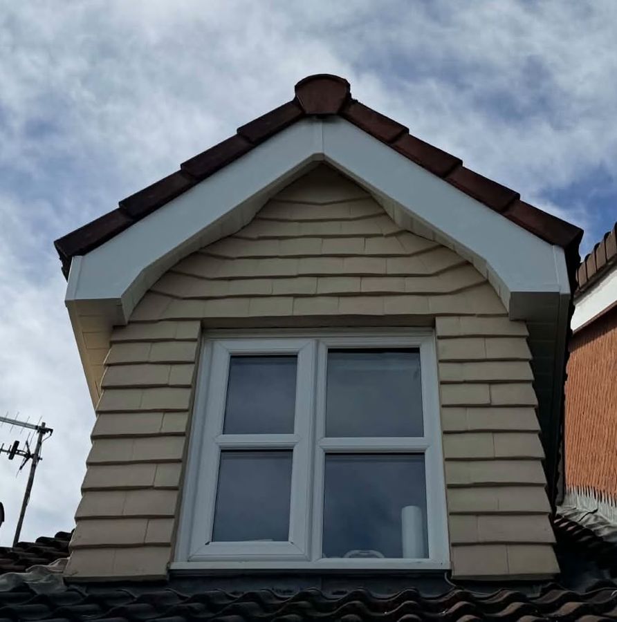 Dormer window with new white fascias and bargeboards